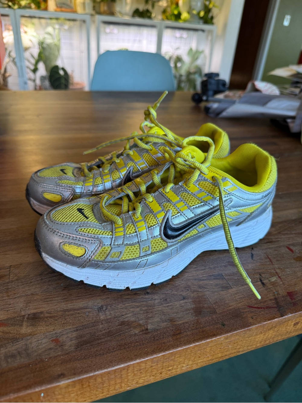Kids yellow Nike p6000 shoes.